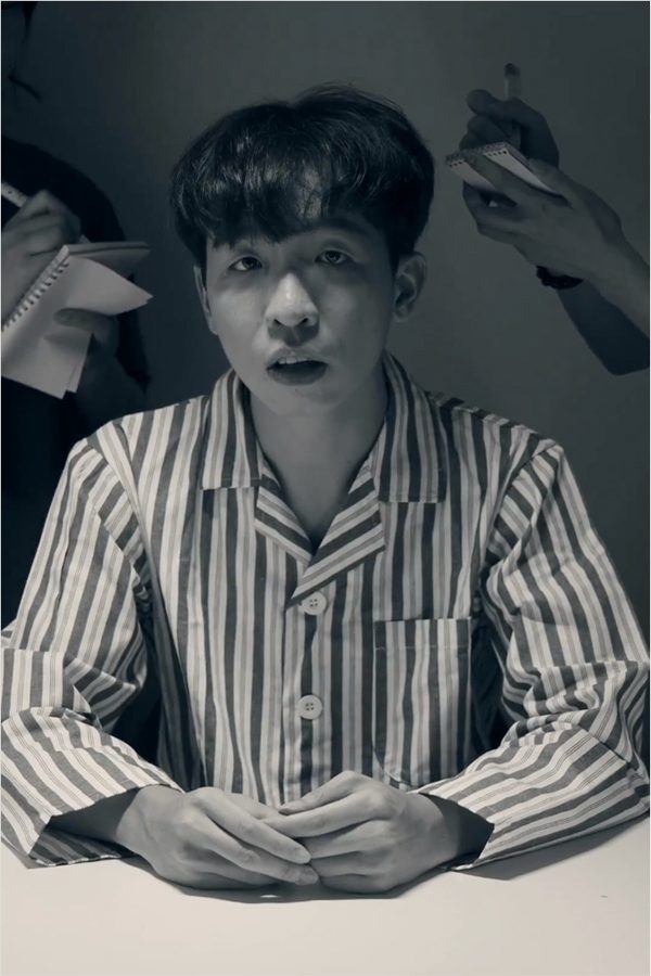 A black and white still during filming